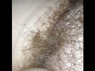 rubbing her natural hairy pussy